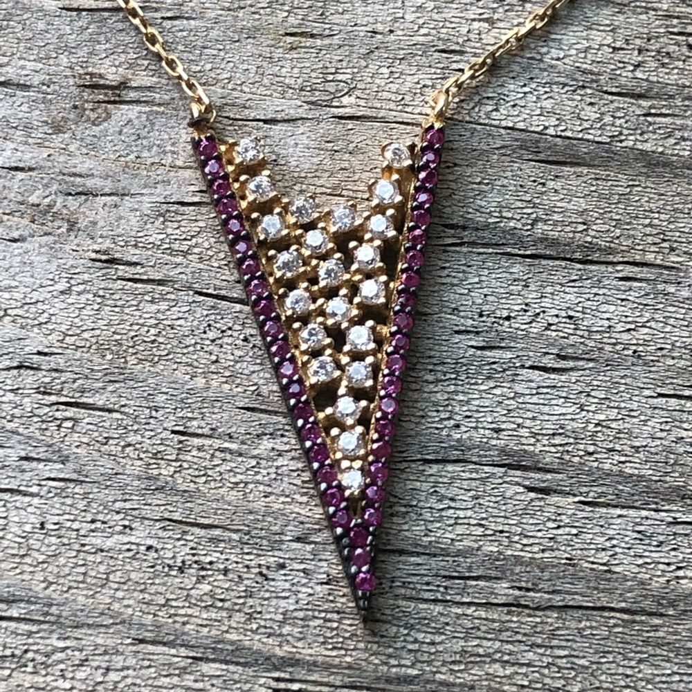Gold-Tone V-Shaped Pendant Necklace with Purple and Clear Stones